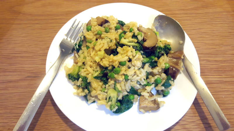 Vegan Meal: Vegan risotto with peas, spinach, broccoli, and mushroom