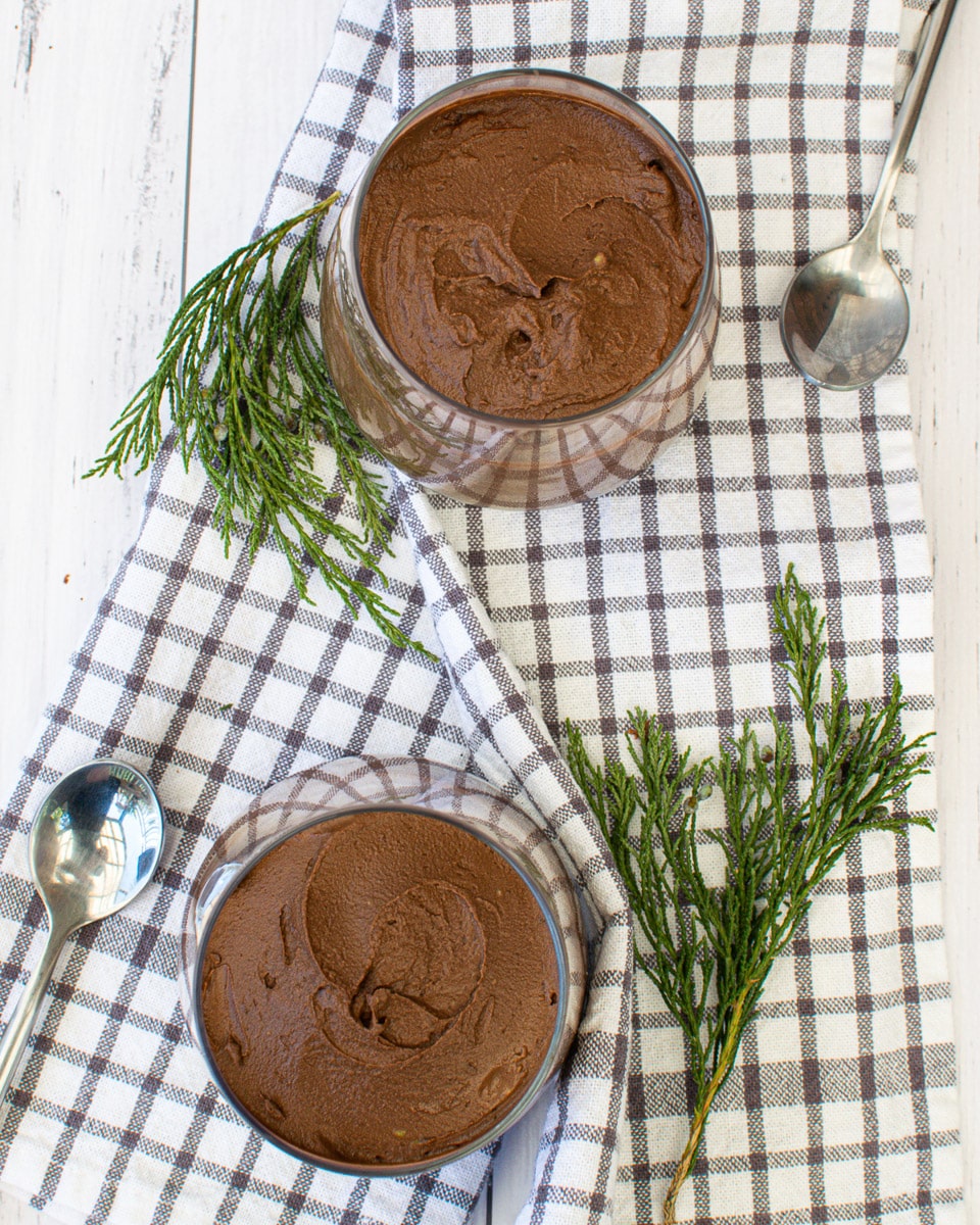 top view of two glasses of vegan chocolate avocado mousse