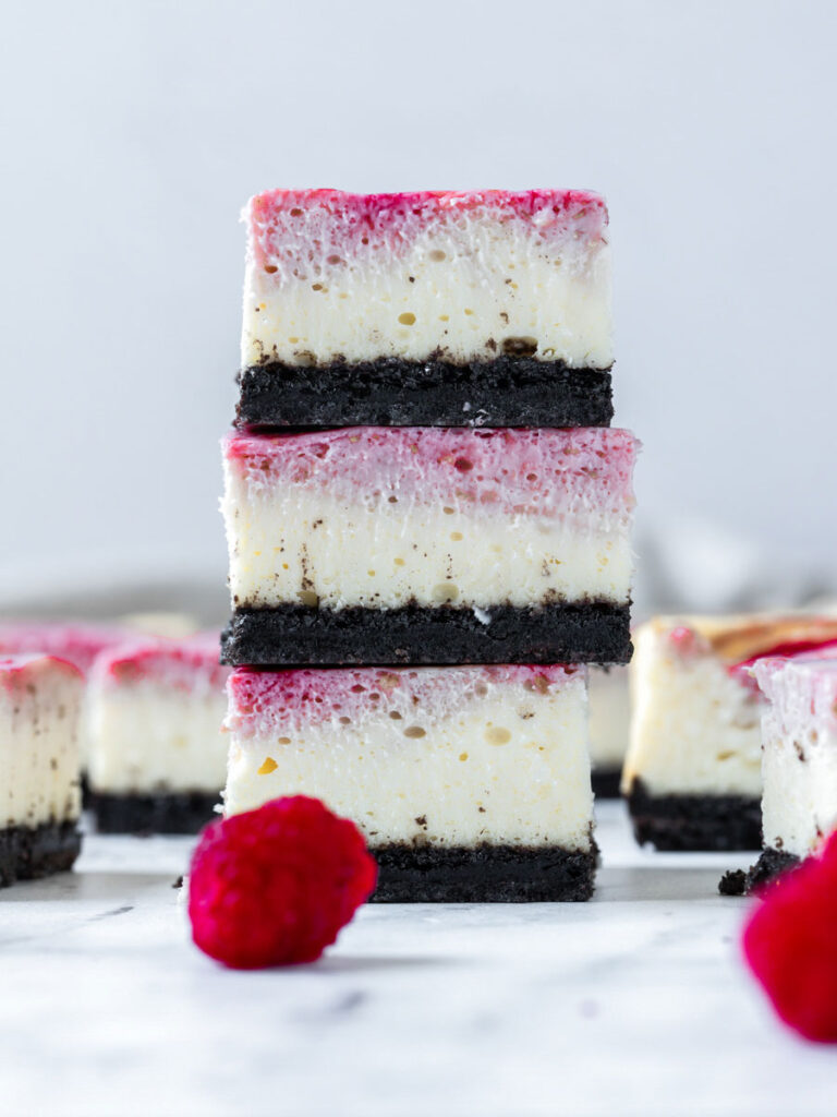 chocolate raspberry bars stacked up on one another