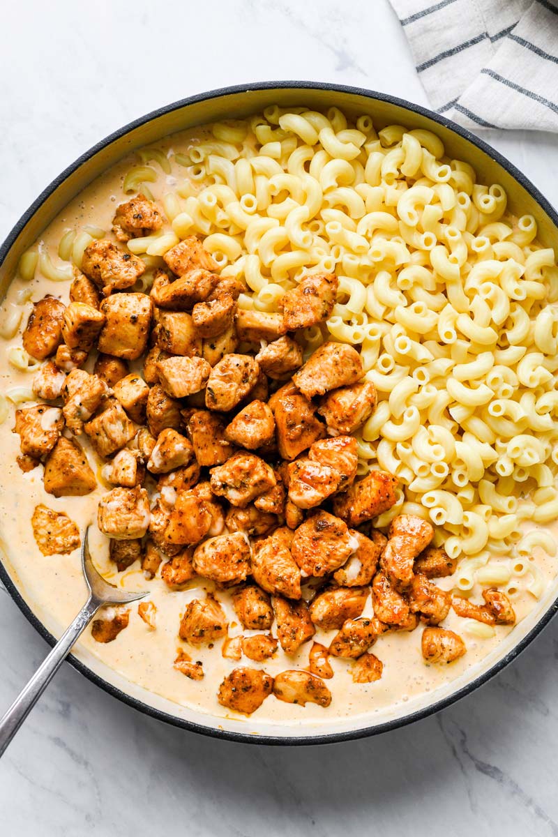 canjun chicken and macaroni added to the skillet
