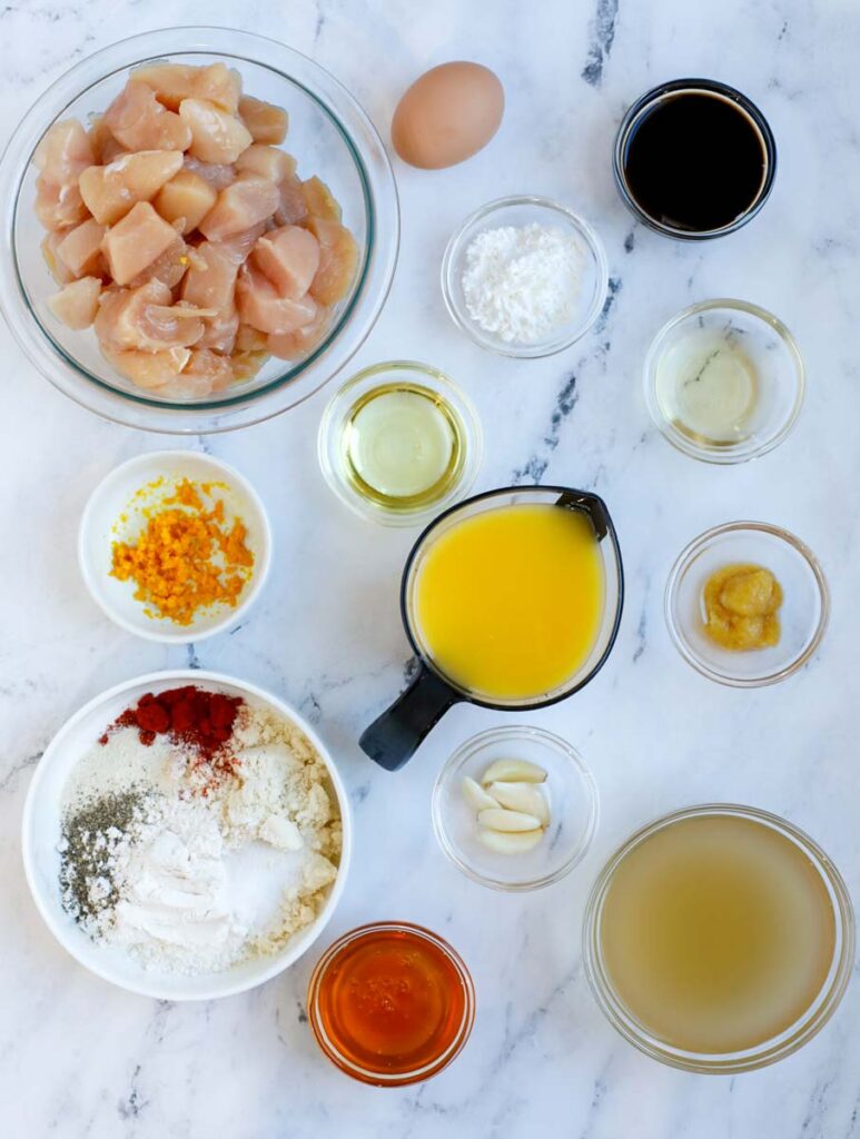 Overhead view of ingredients needed to make healthy orange chicken.