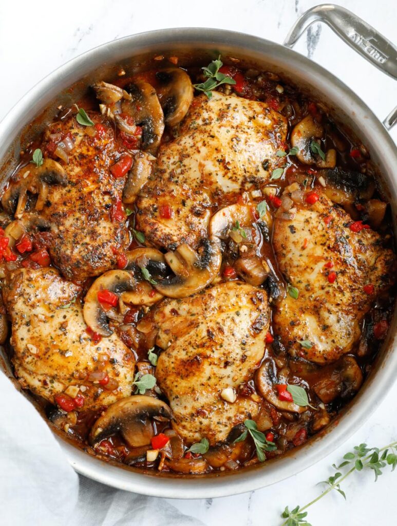 Top down shot of tuscan chicken in a skillet.