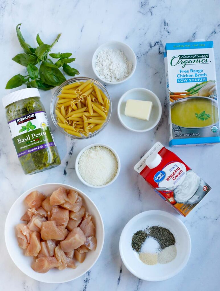 Ingredients needed to make a pesto pasta with chicken.