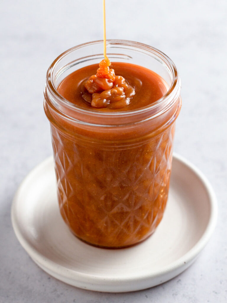 Caramel sauce in a a jar.