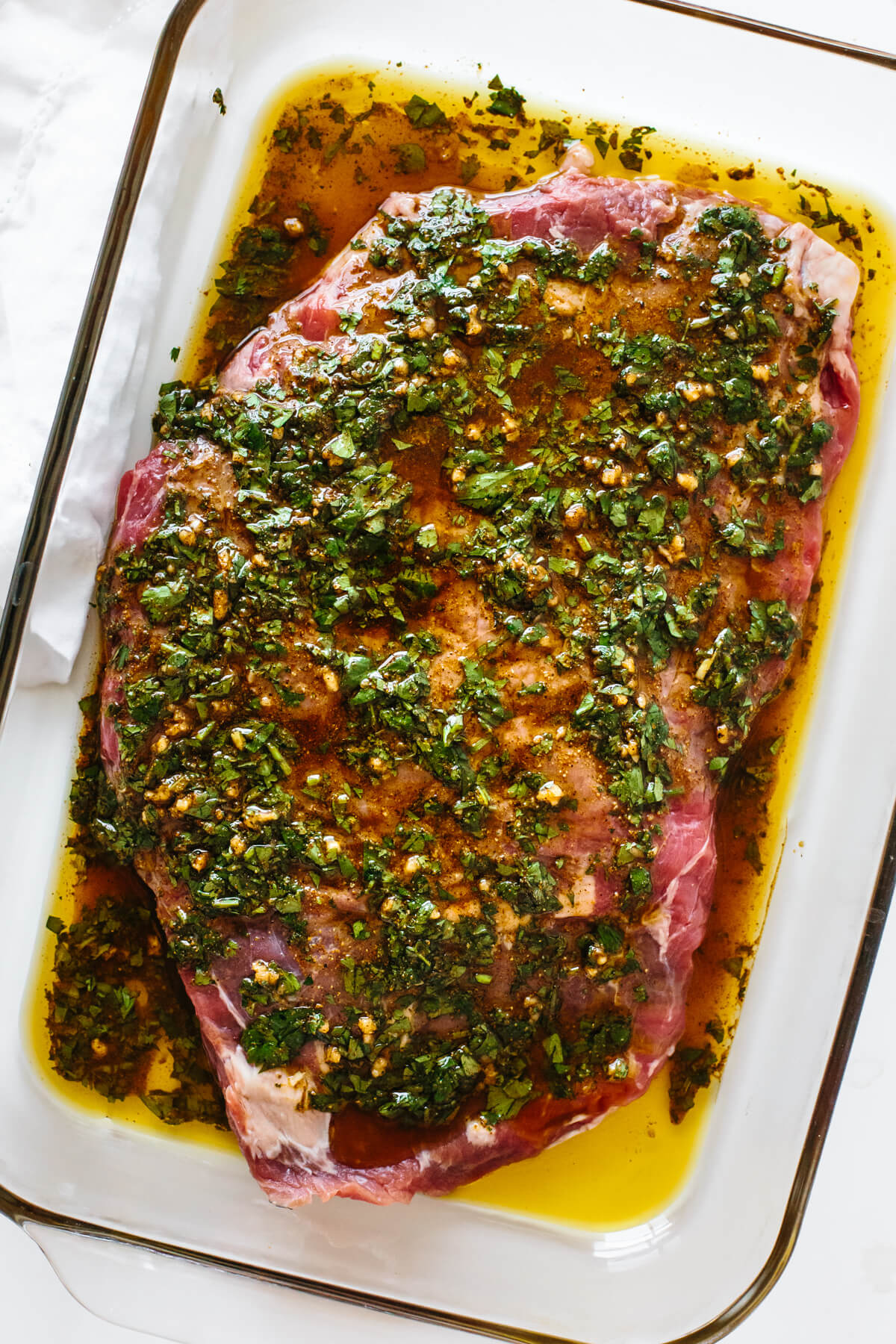 Flank steak marinating in carne asada marinade.