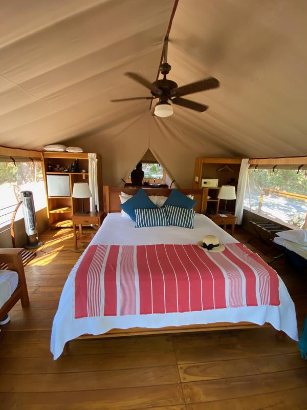 Bed inside of a glamping tent. 