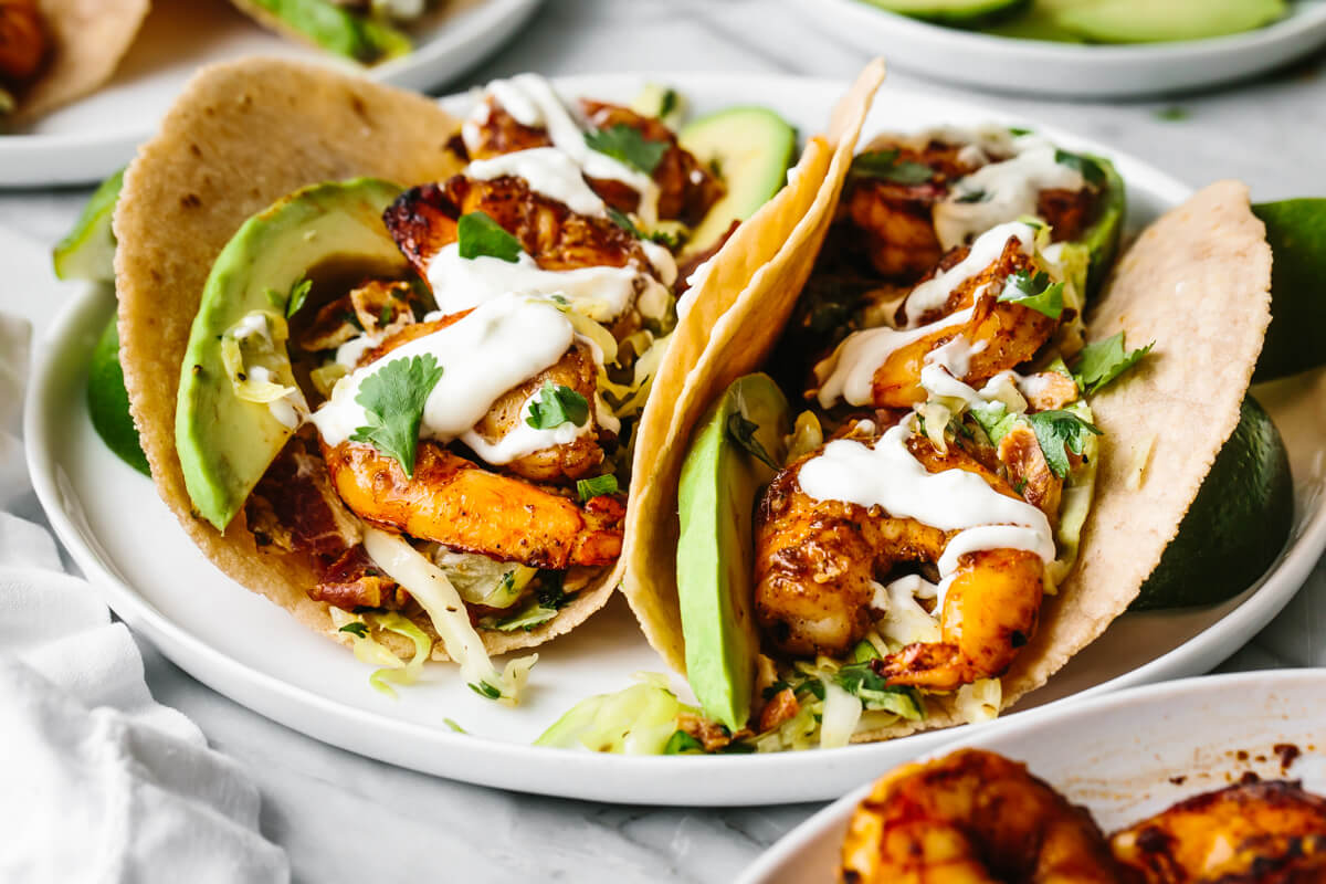 A plate of shrimp tacos with cilantro lime slaw.