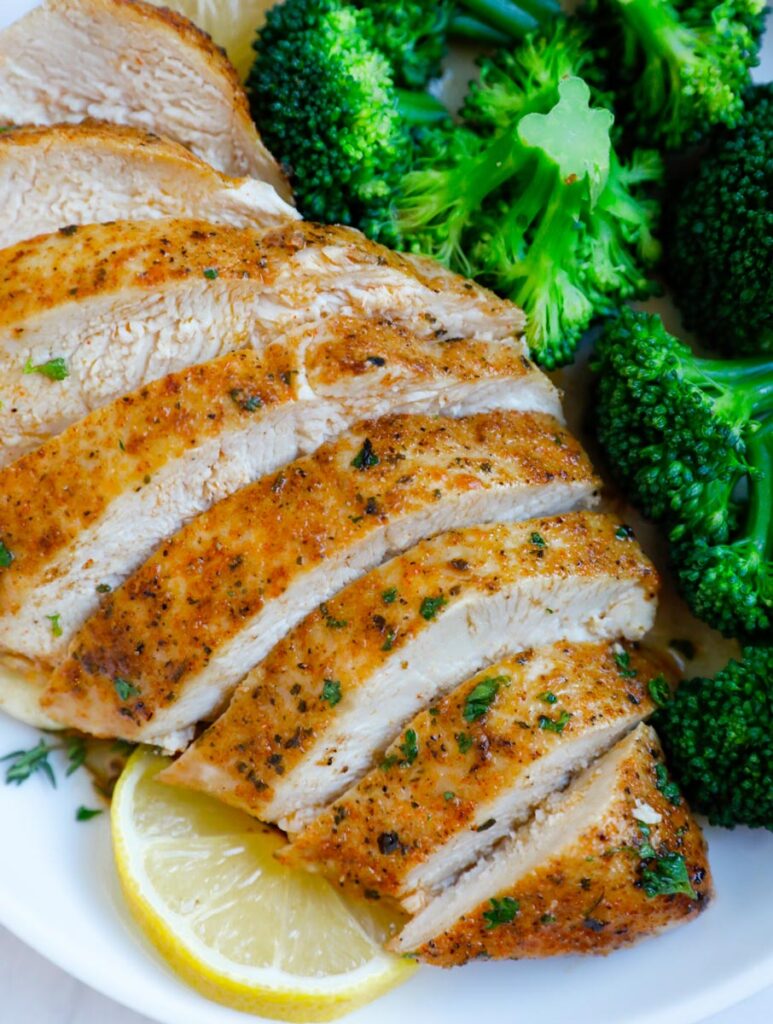Close up of sliced baked chicken breasts.