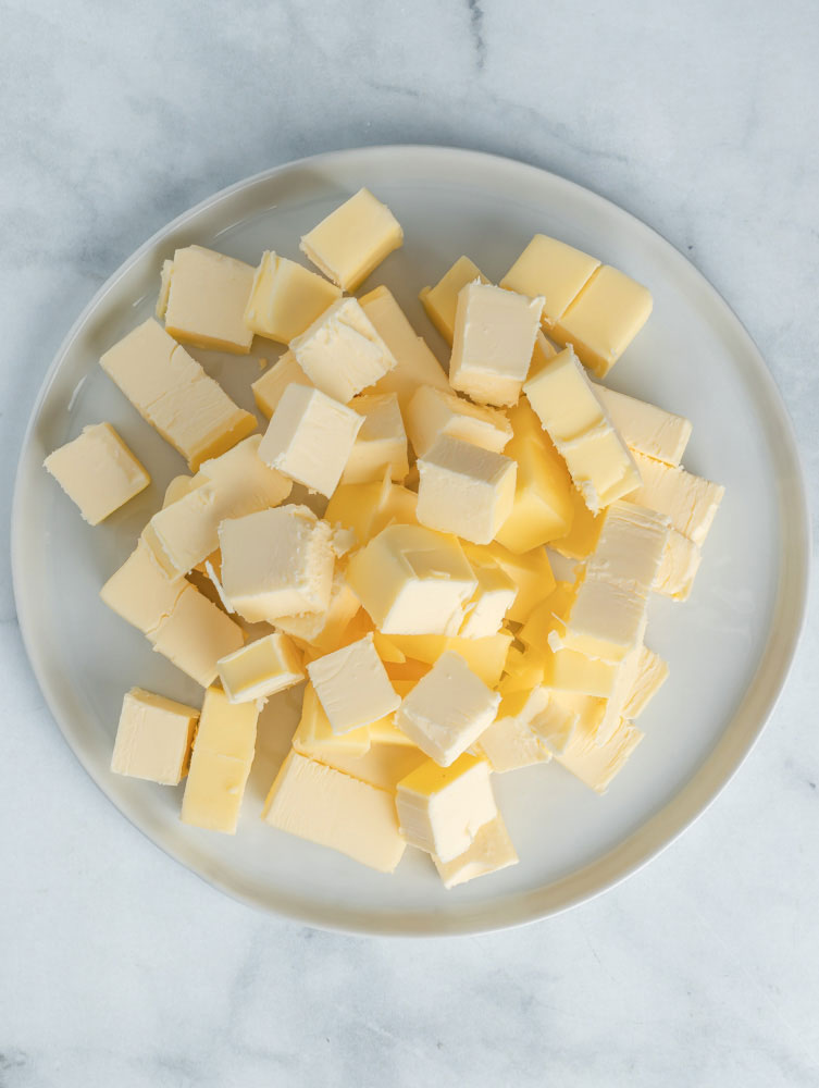Cubed butter on a plate.