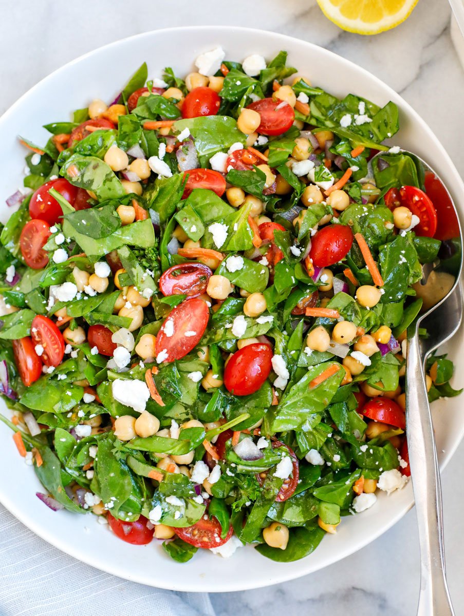 A plate of chickpea and spinach salad.