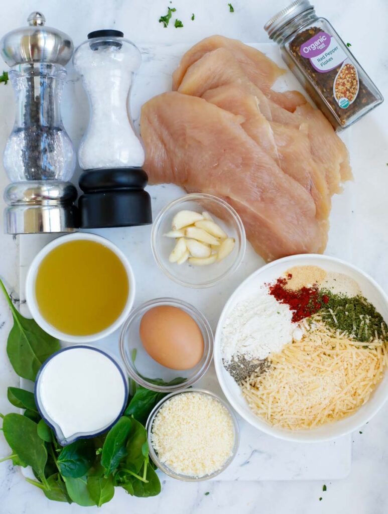 Ingredients needed to make creamy parmesan chicken.