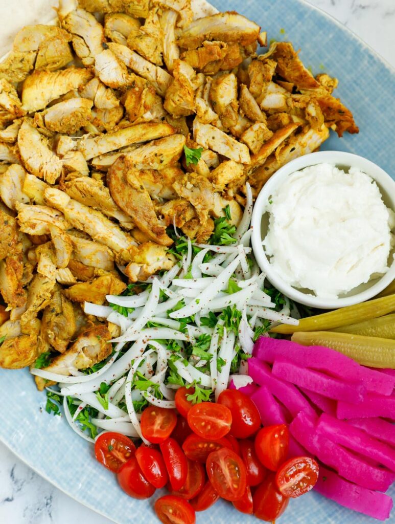 Close up of a platter of chicken shawarma.