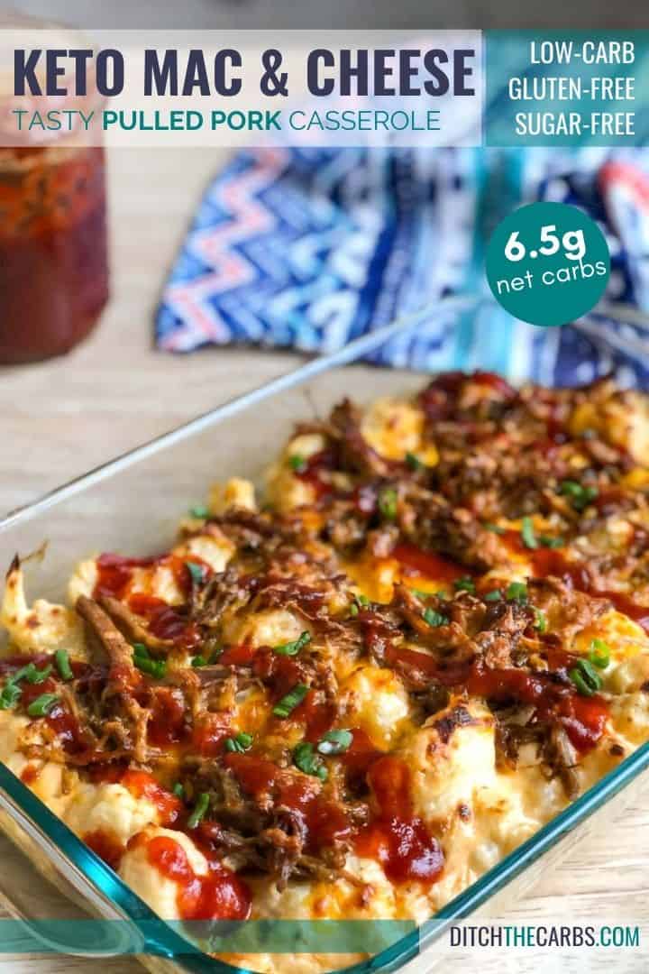 Keto pulled pork mac and cheese in a clear glass casserole pan with keto BBQ sauce drizzled  on top.
