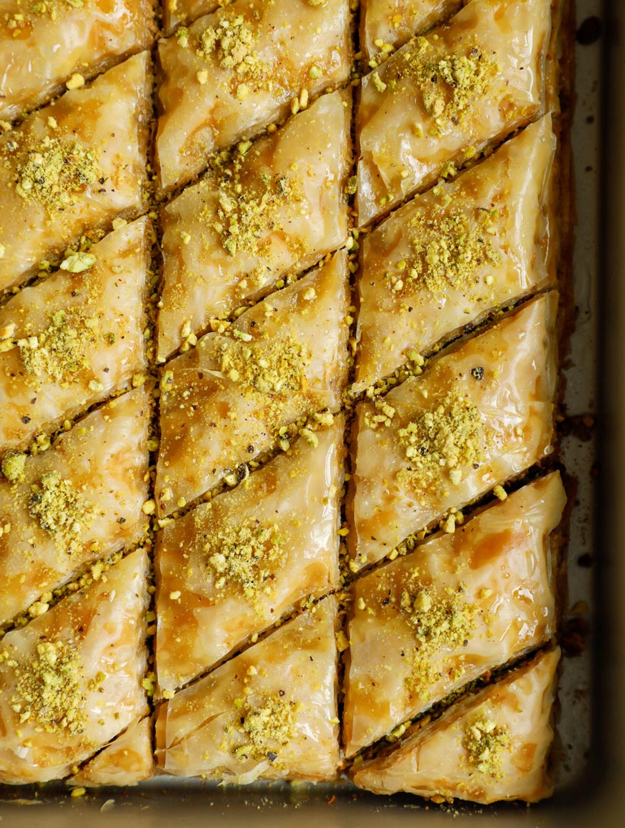 Close up of pistachio baklava in the pan.