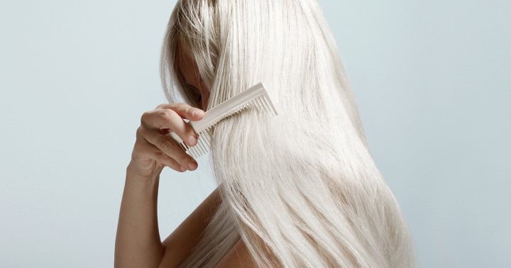 Here's What's Actually Causing Your Oily Roots & What To Do About It