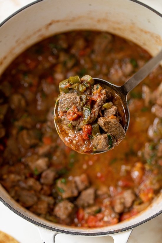 Mexican Beef Stew with a ladle.