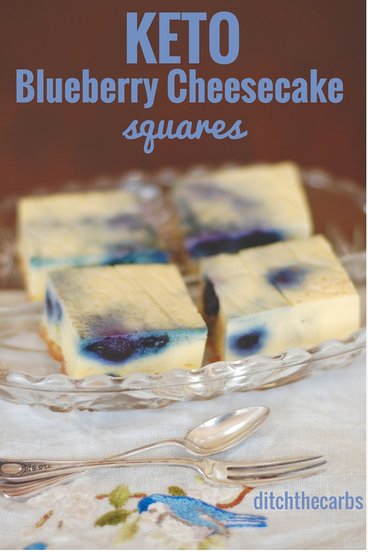 Keto blueberry cheesecake squares on a serving dish