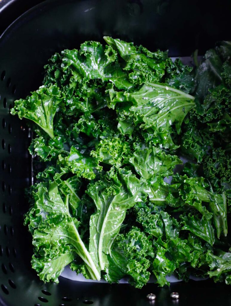 Kale leaves in an air fryer.