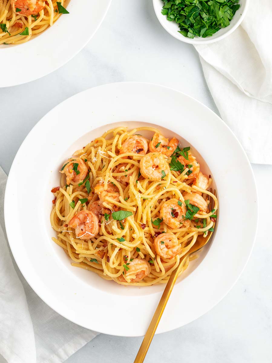 shrimp pasta in a white plate