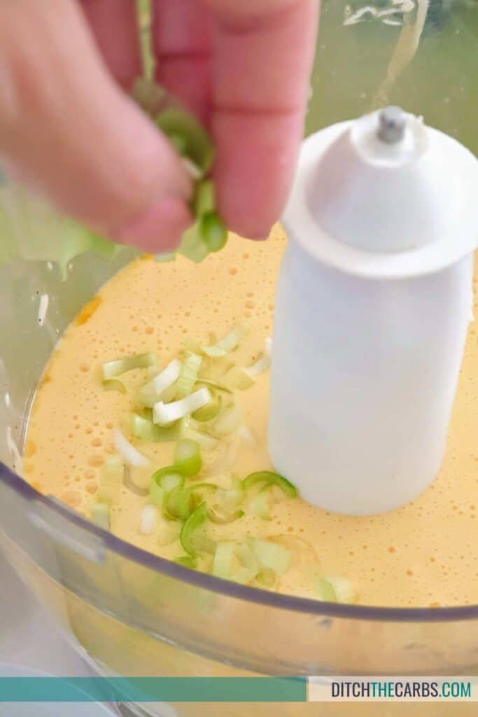 food processore with egg mix and spring onions
