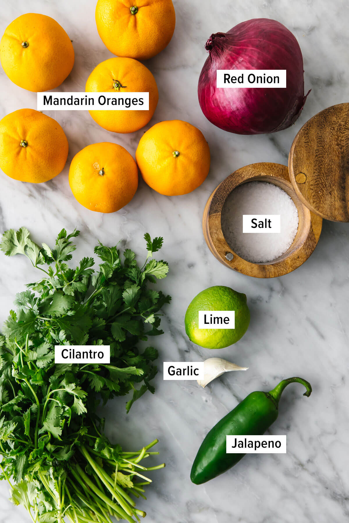Ingredients for mandarin orange salsa on a table.