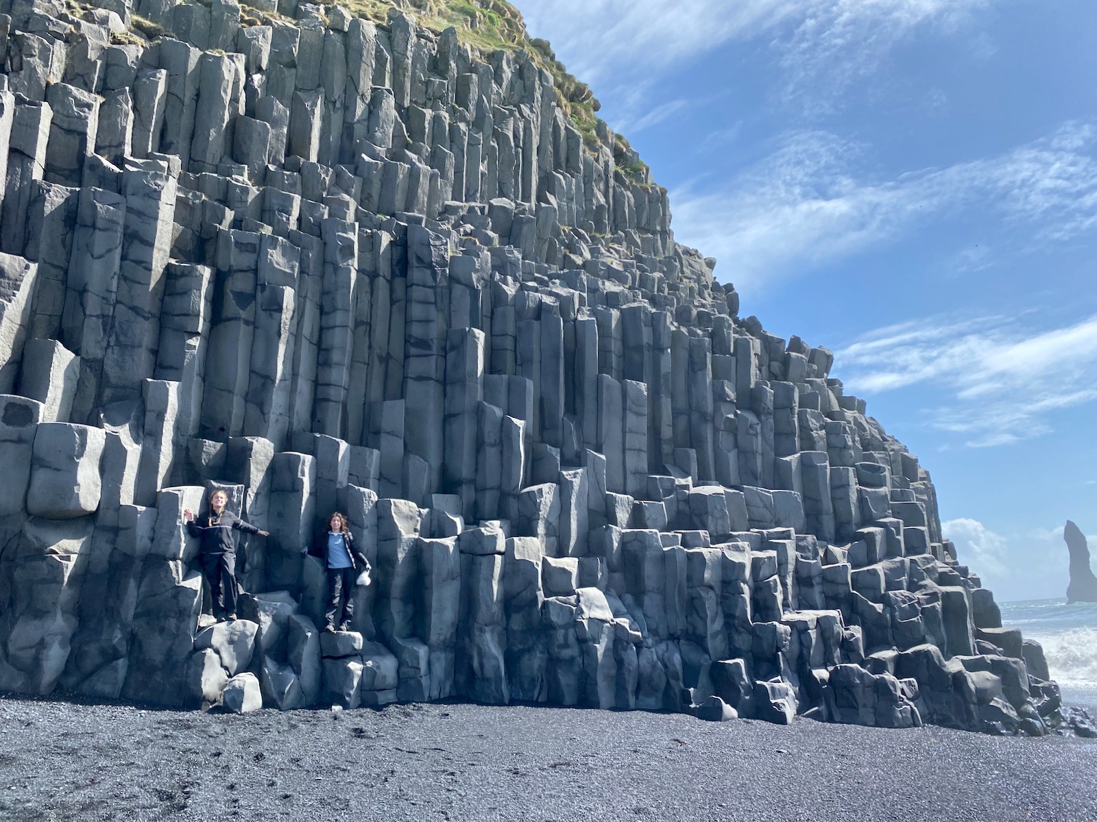 Sisters posing on the Basalt Columns in Iceland. 