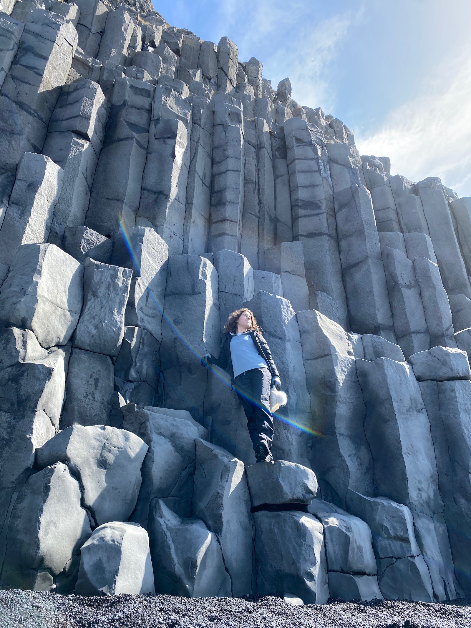 Teen girl posing on the Basalt Columns in Iceland. 