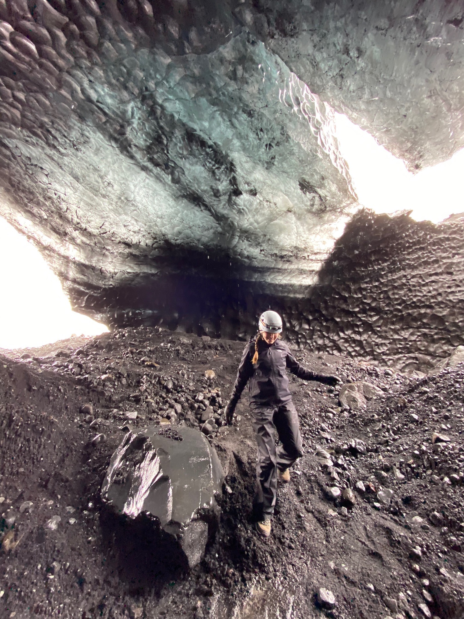 Teen girl exploring the ice caves in Iceland. 