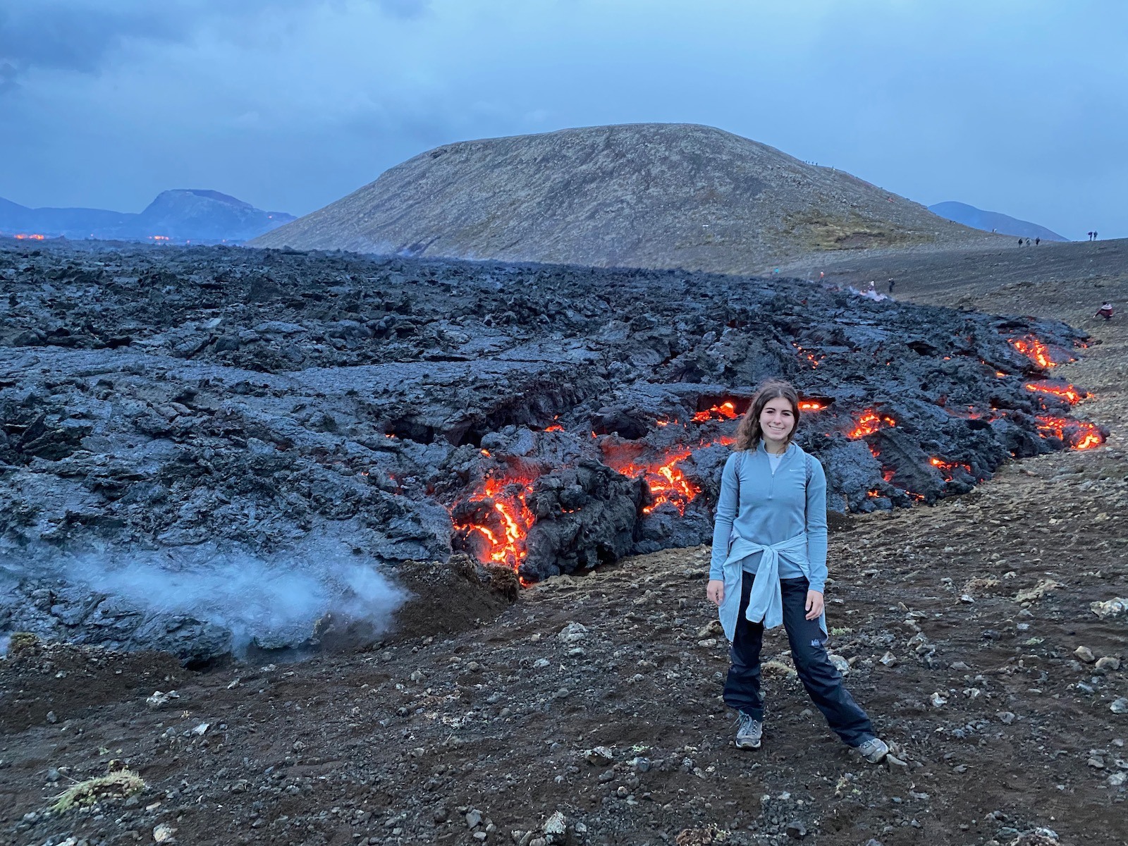Teen girl posing in front of Fagradalsfjall Volcano. 