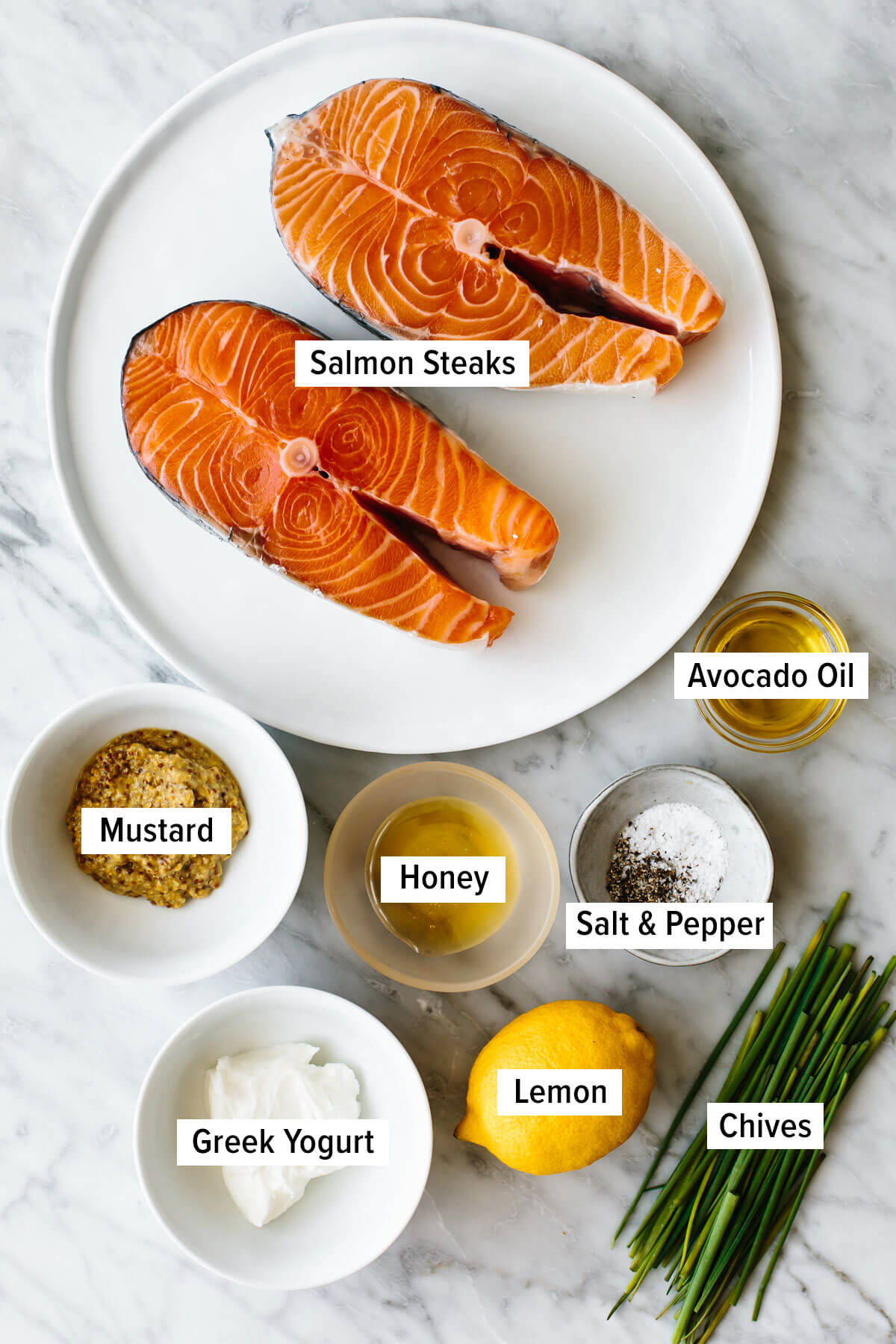 Ingredients for grilled salmon steak on a table.