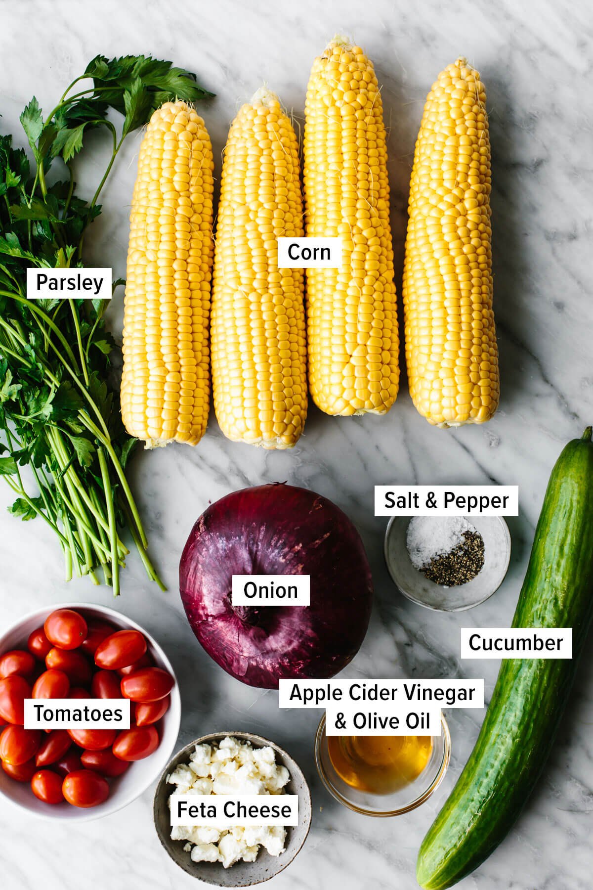Ingredients for grilled corn salad on a table.