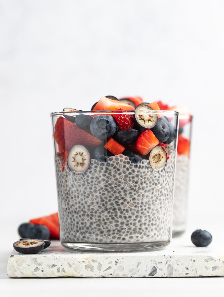 close up shop of chia pudding with berries on top