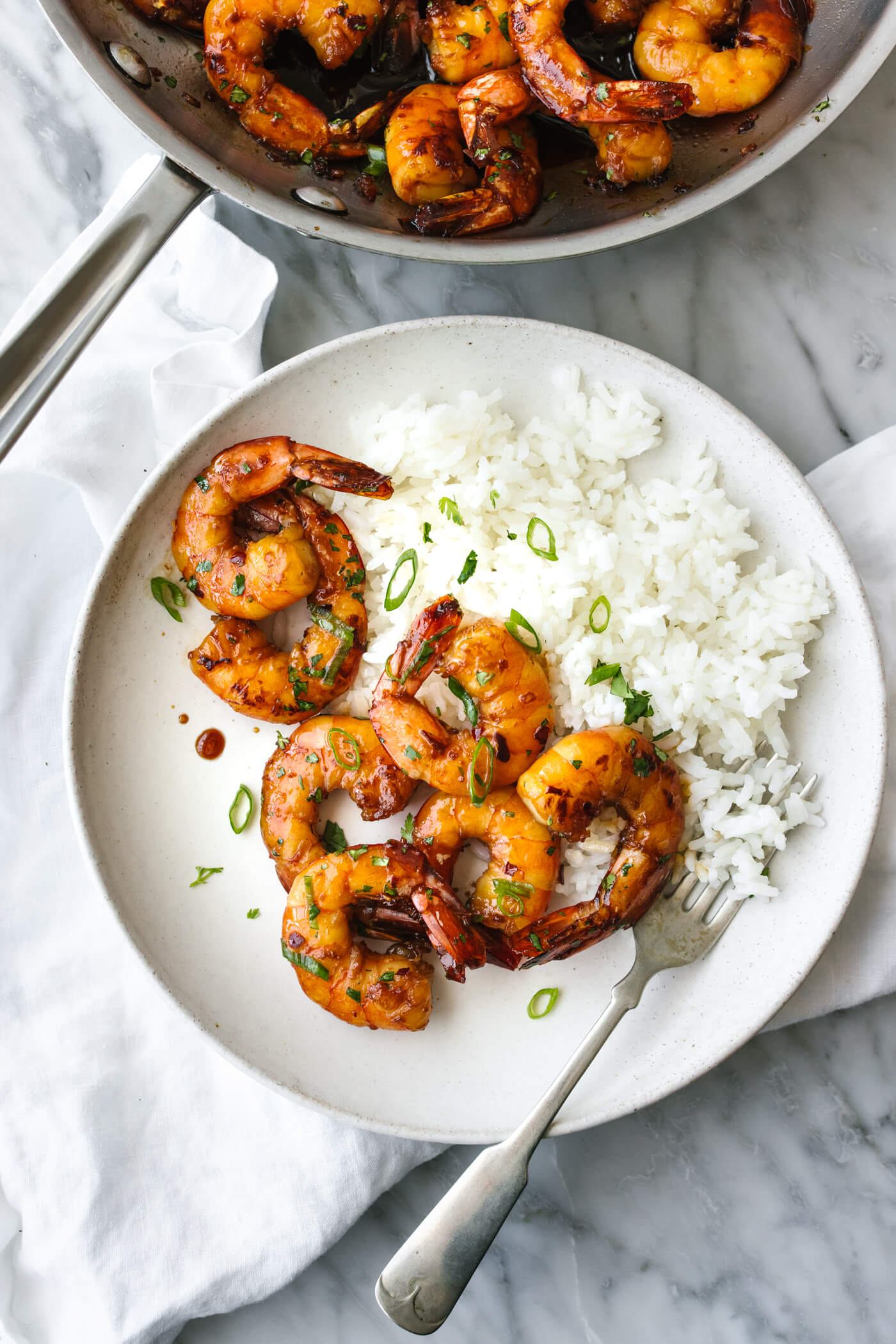 Honey garlic shrimp on a plate with white rice