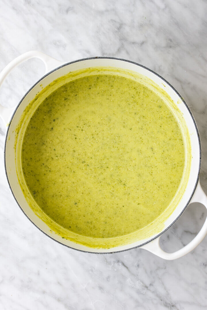 Blended zucchini soup in a big white pot