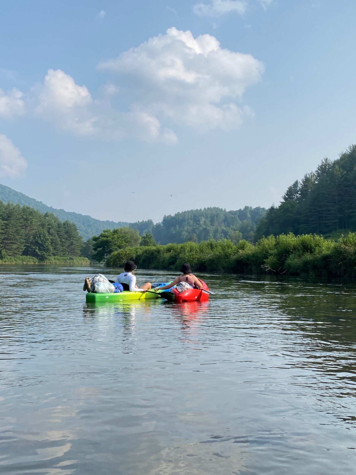 Two people in kayaks on a river in North Carolina. 