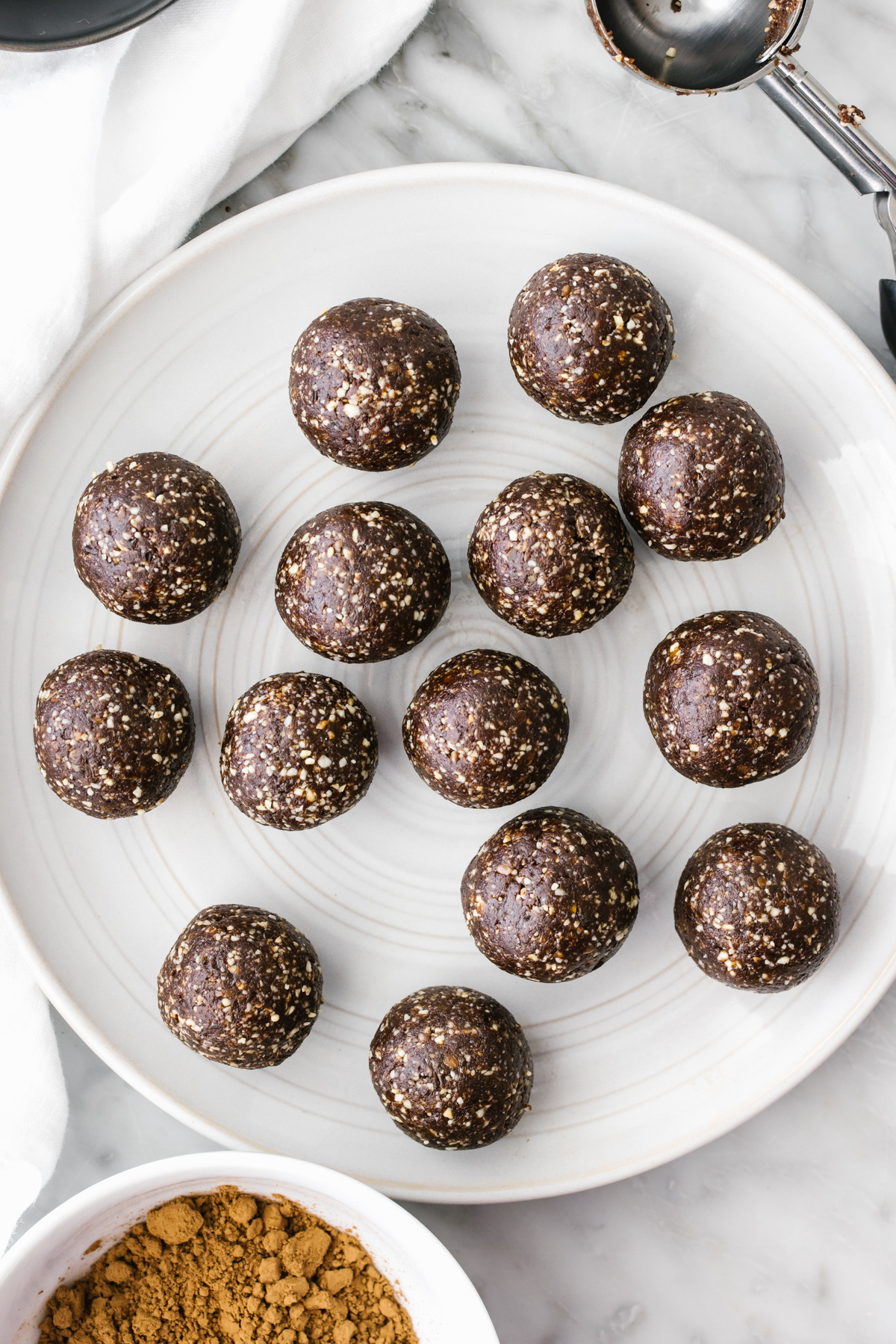 Mint chocolate energy balls on a plate.
