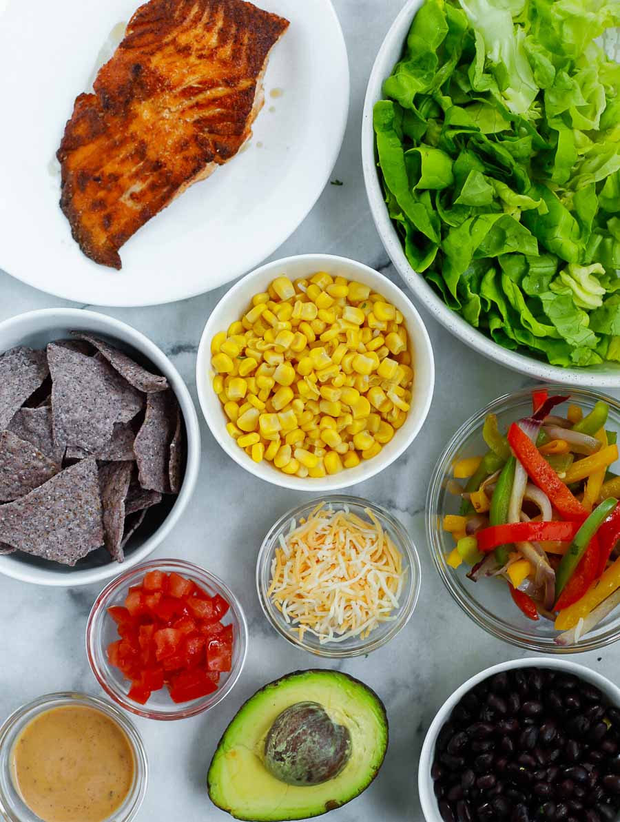 ingredients of the salmon burrito bowl laid out