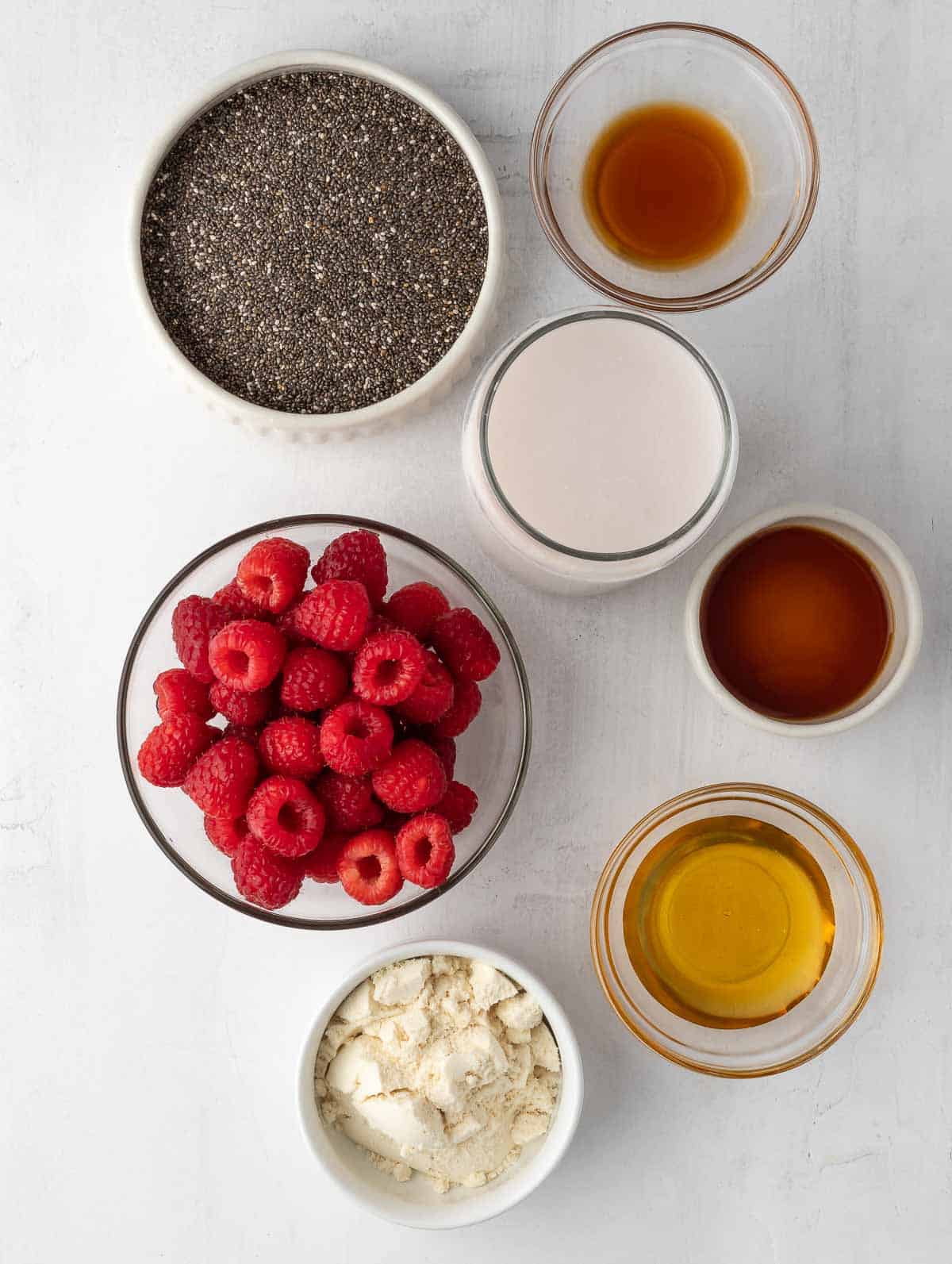 ingredients of Raspberry Protein Chia Seed Pudding laid out