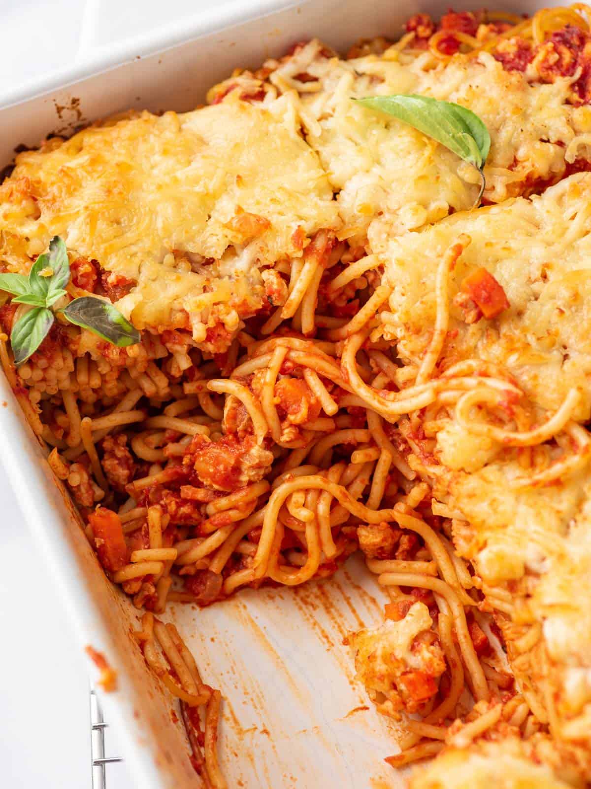 Easy Spaghetti Bake showing in the center in a dish