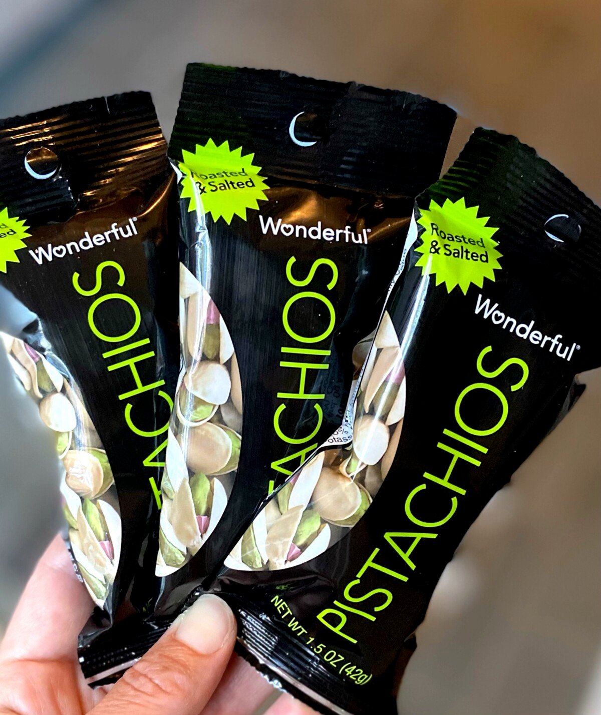 Three snack sized bags of Pistachios as healthy snacks. 