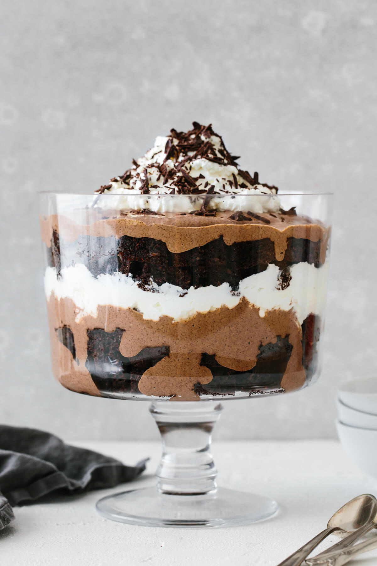 A layered brownie trifle in a trifle bowl.