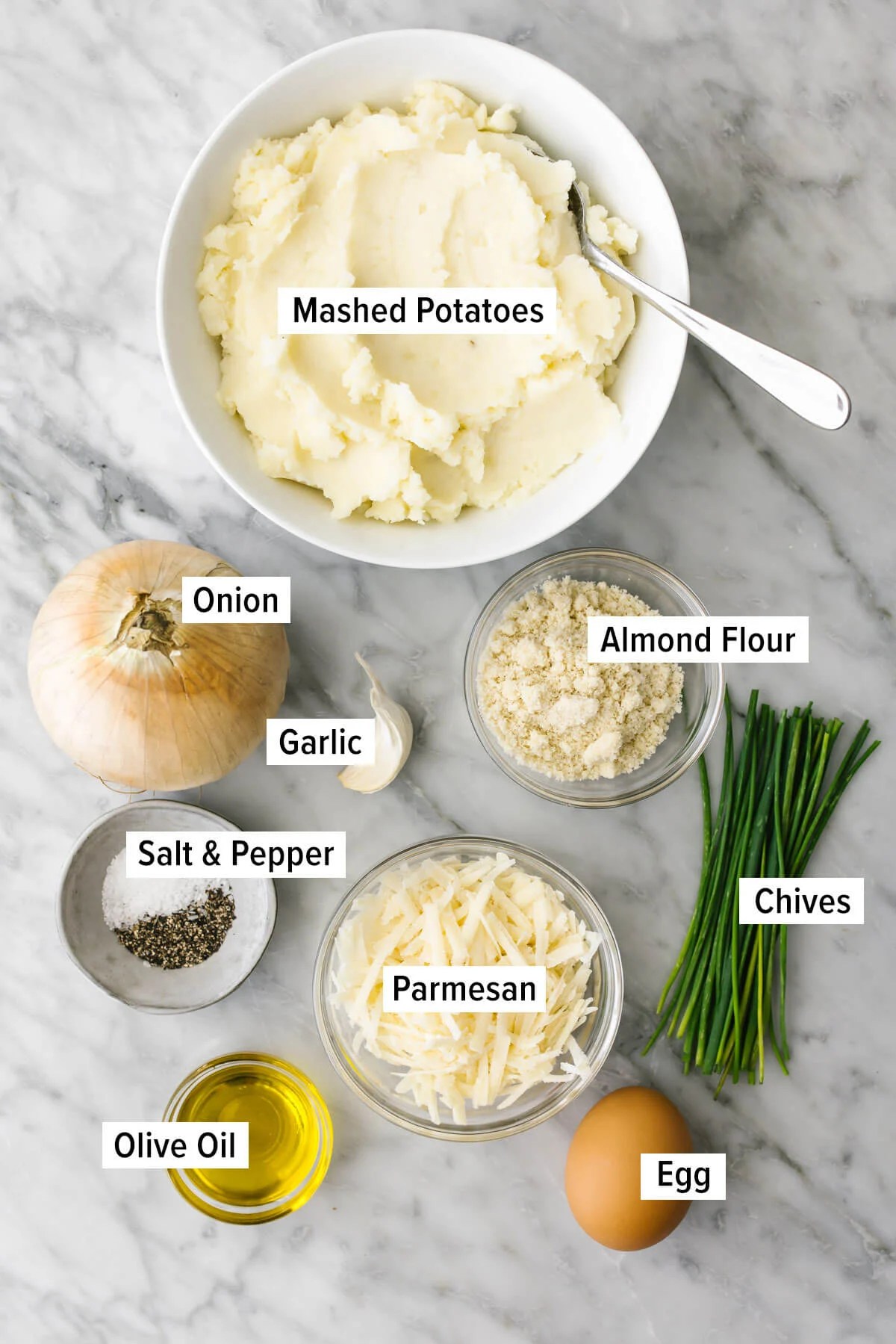 Ingredients for potato pancakes on a table.