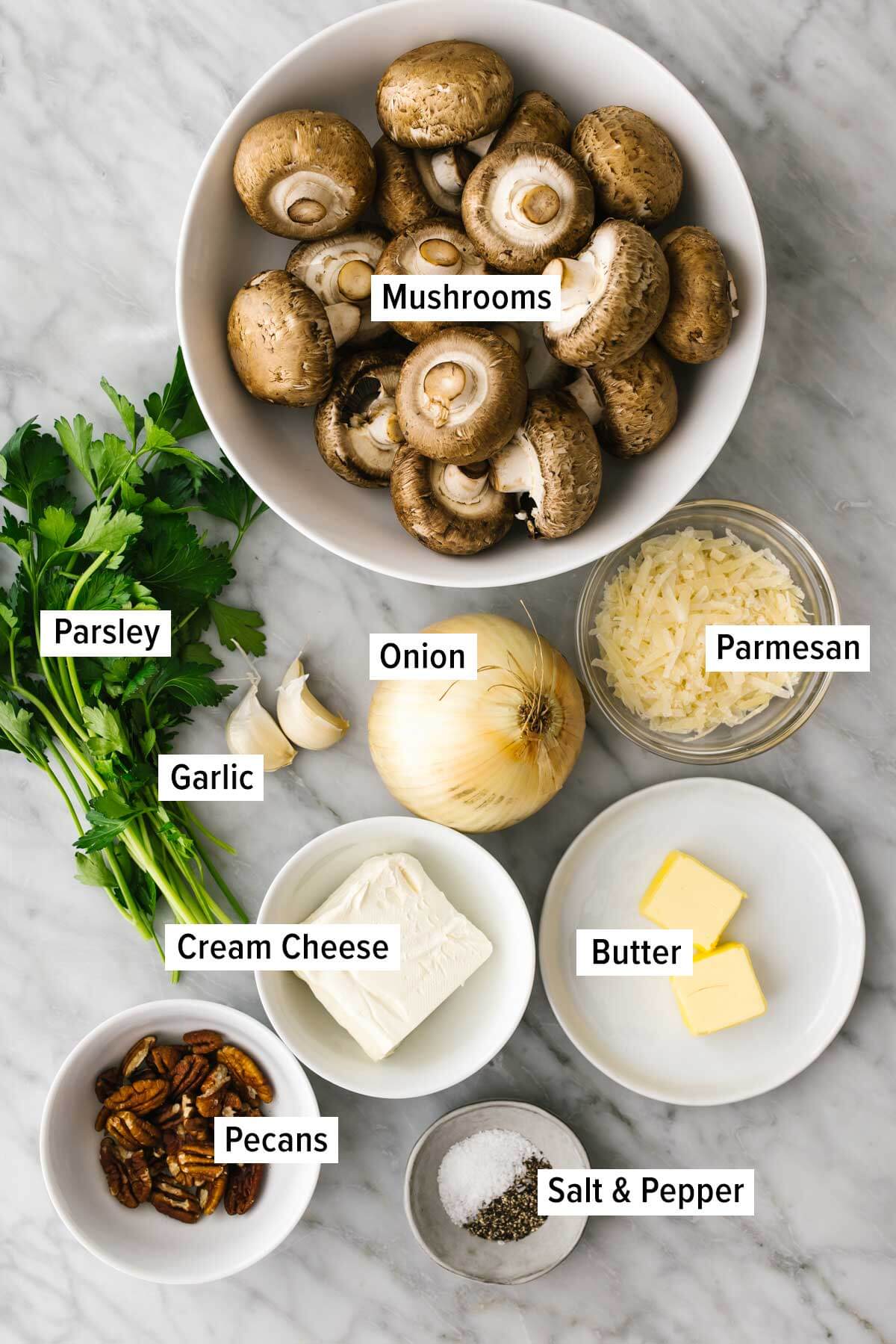 Ingredients for stuffed mushrooms on a table.