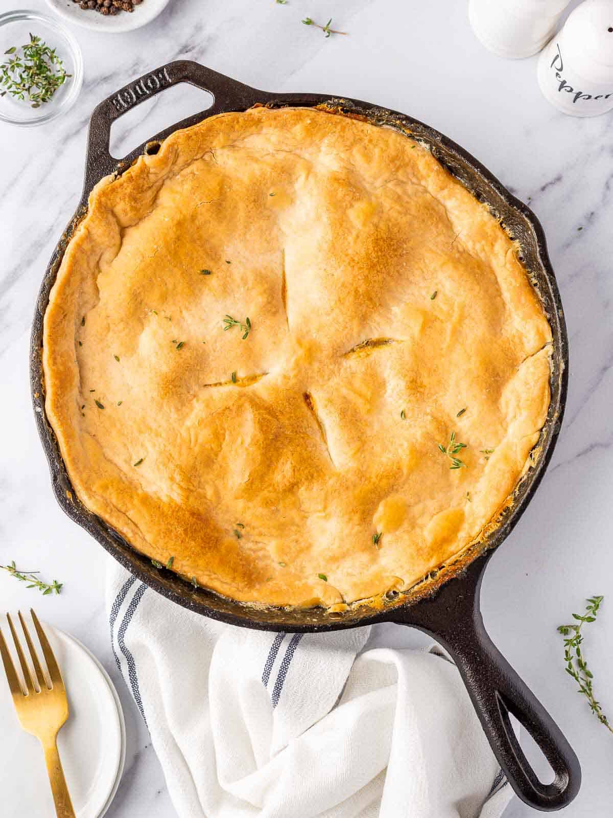 finished chicken pot pie in a black iron skillet